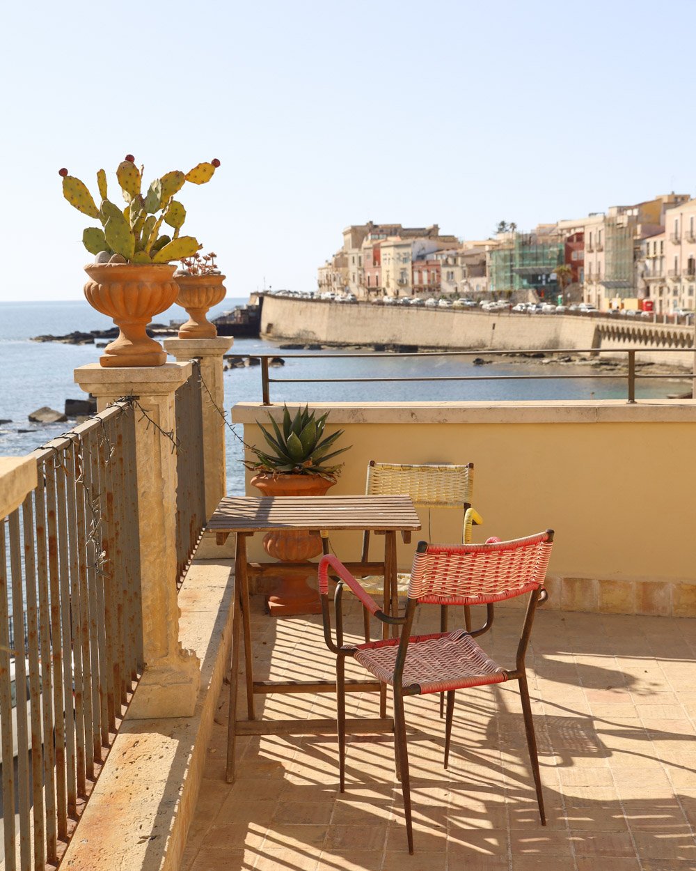 Outdoor patio overlooking ocean in Sicily